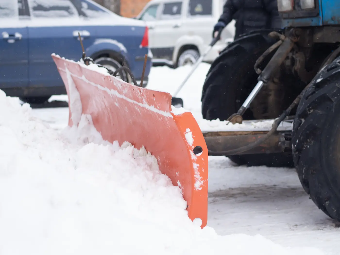 tractor-cleans-snow-with-shovel-closeup